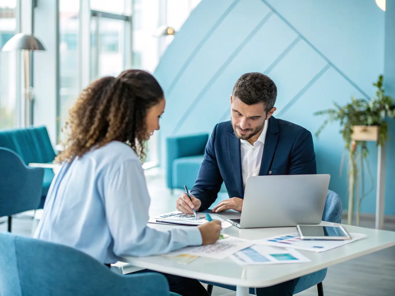 A professional office setting with consultants collaborating with clients, showcasing personalized support and guidance.